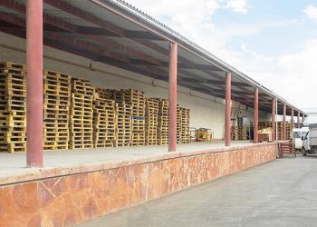 How many warehouses does a region need to store harvested fruits and vegetables in Kazakhstan